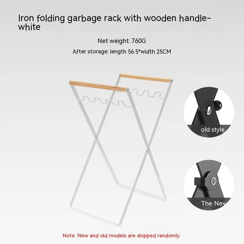 Black folding iron trash rack with wooden handles holding a bin bag outdoors