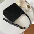 Two women's soft PU shoulder bags with swing threads, one black and one brown, showing structured design.