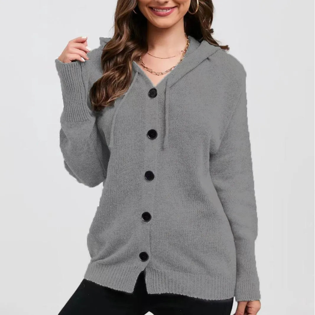 Women's solid colour loose-fit hooded cotton cardigan sweater on a hanger.