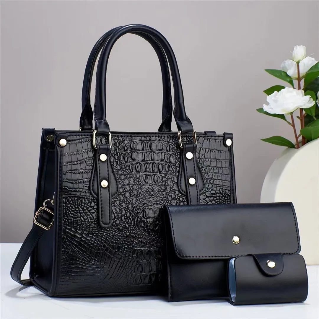 Women's burgundy PU leather bucket crossbody bag set with matching wallet and card holder.