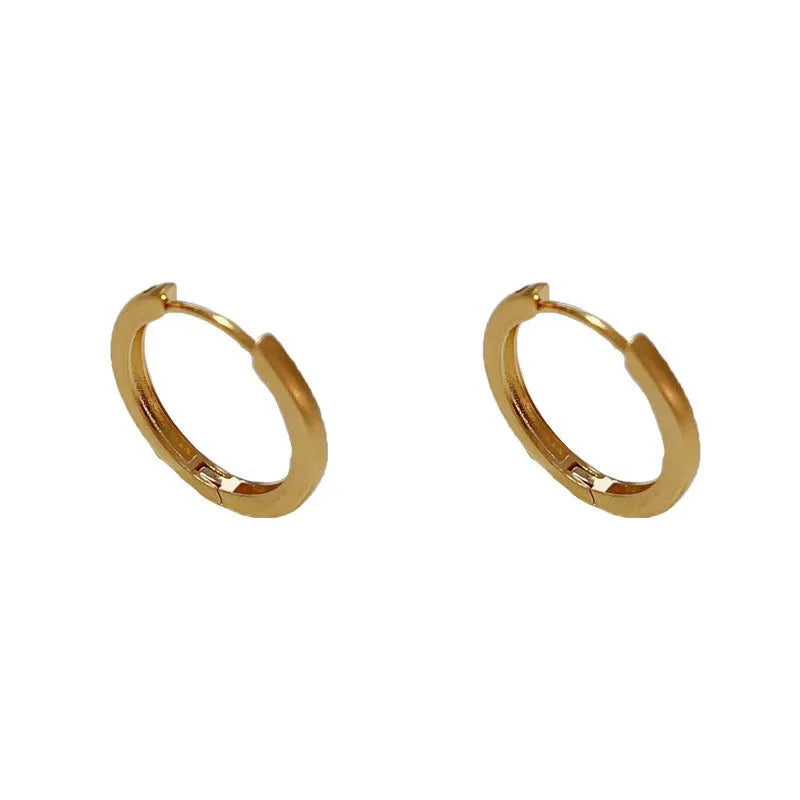Geometric gold or silver-plated ear clip with round eyelet detail for women