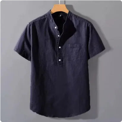 Man wearing a beige slub linen casual shirt with a stand collar and short sleeves, loose fit.