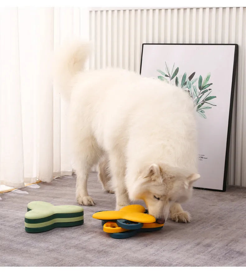 Green and yellow dog puzzle toy with nine bone-shaped covers on a non-slip base.