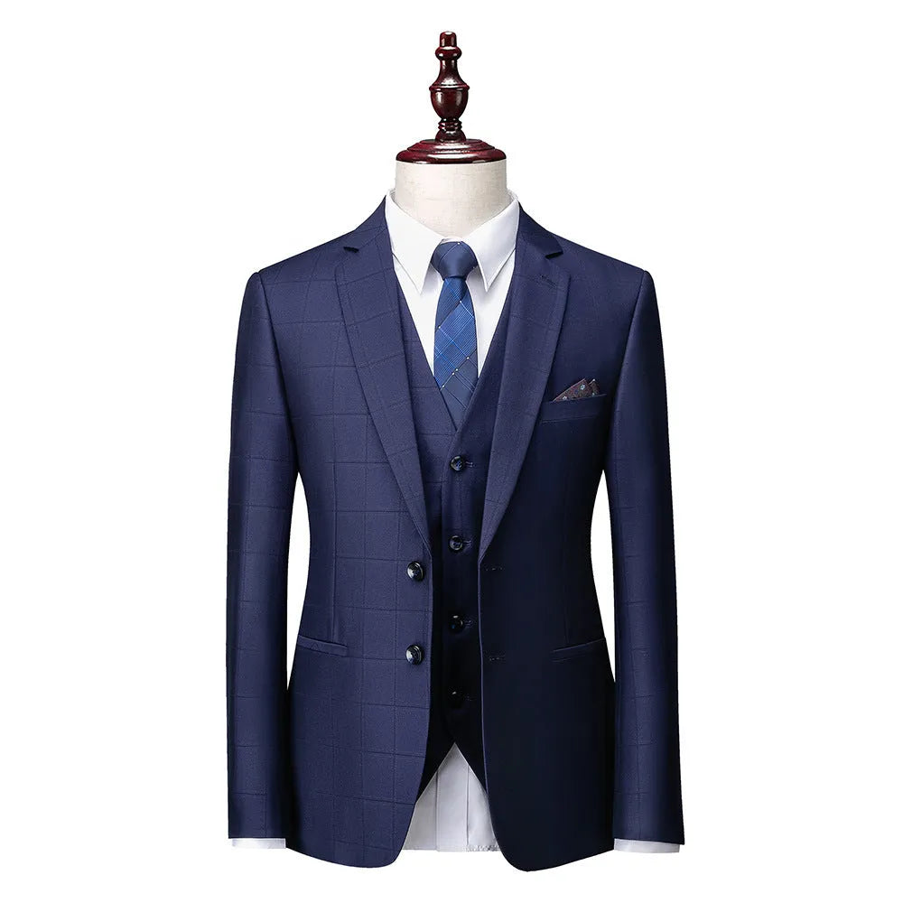 Men's navy blue slim fit three-piece plaid suit with jacket, vest, and trousers on a hanger.