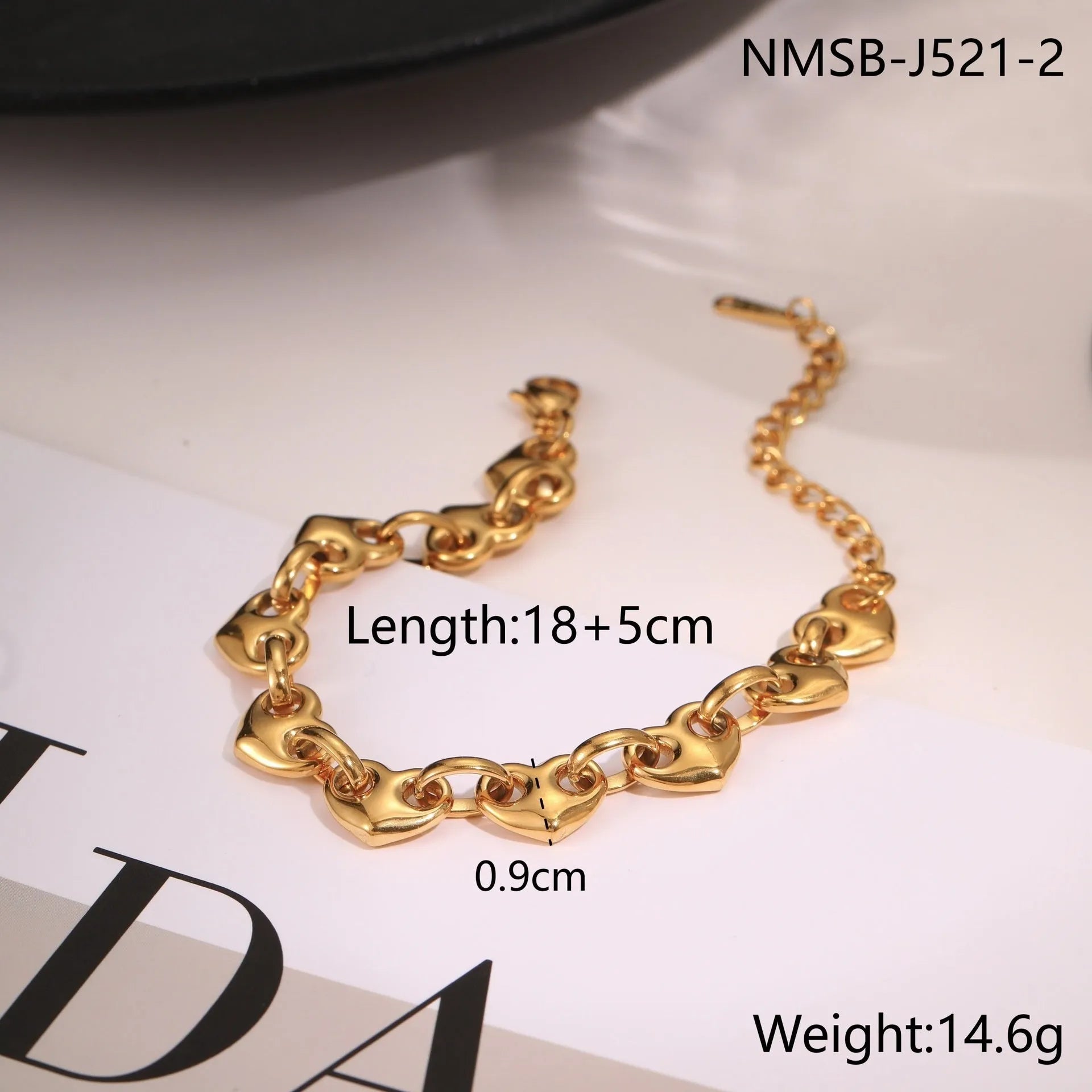 Women's geometric hollowed-out heart bracelet in stainless steel, available in gold or steel colour.