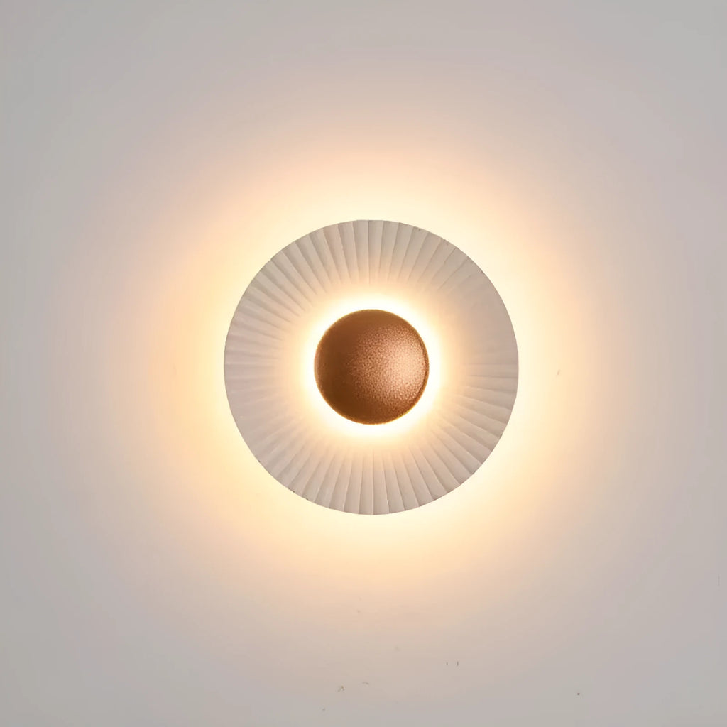 Round aluminium wall lamp with LED light in a choice of colour finishes including white and gold.