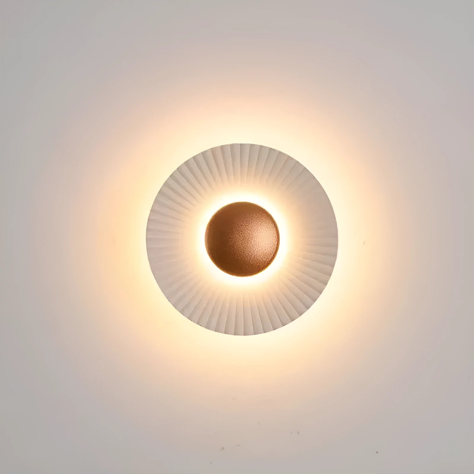 Round aluminium wall lamp with LED light in a choice of colour finishes including white and gold.