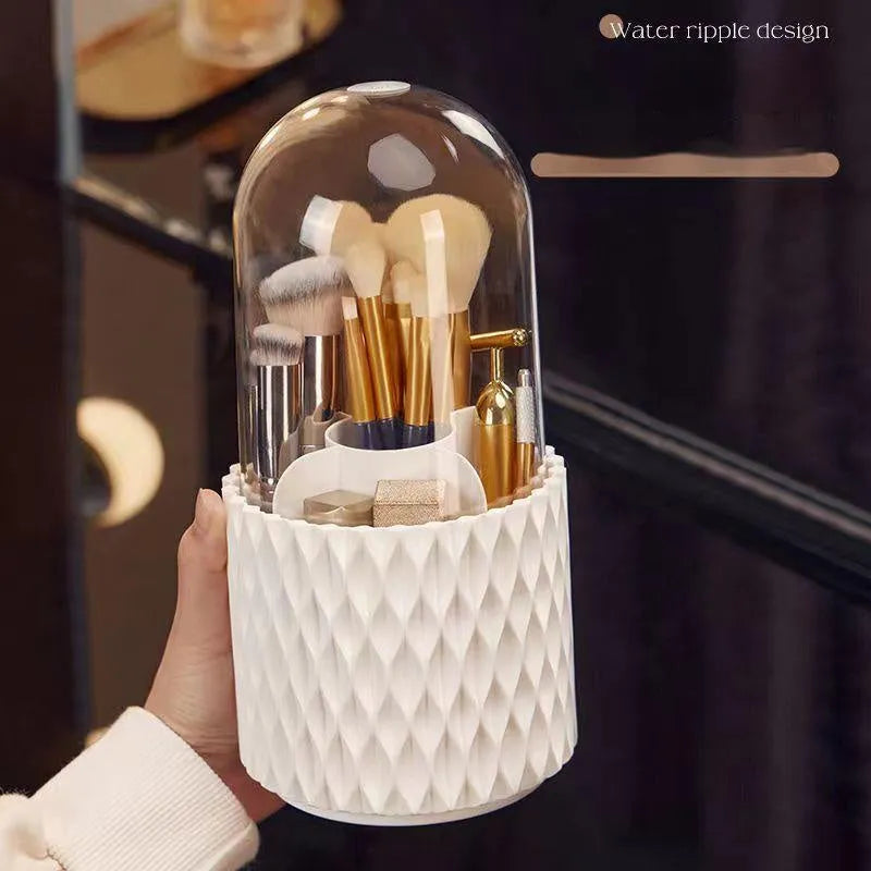 White acrylic rotating makeup brush holder with transparent dust cover on desktop