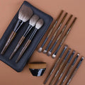 12 piece makeup brush set with wooden handles in a grey PU storage bag