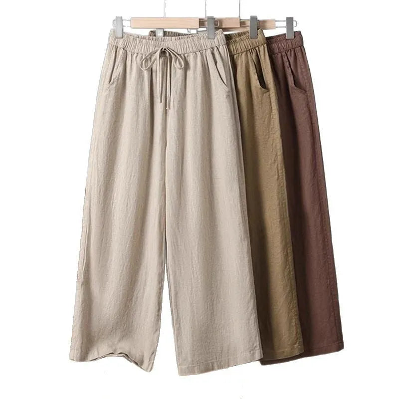 Women's straight-leg casual trousers in apricot colour with elastic waist and lace-up drawstring detail