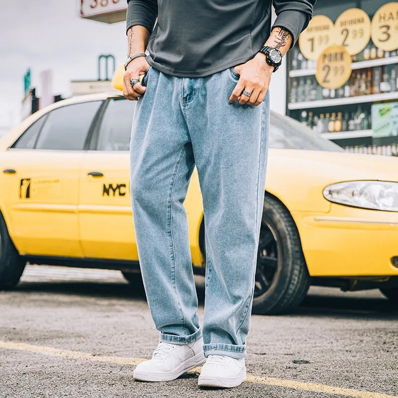 Men's loose straight cotton jeans in dark blue, light blue, and grey colours with mid-rise waist