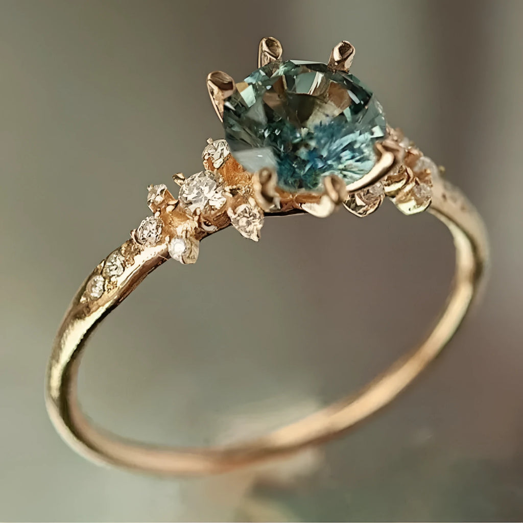 Gold geometric ring with claw setting and inlaid zircon element on alloy band