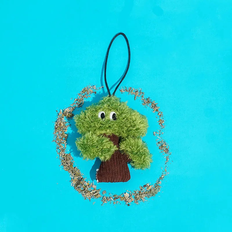 Plush pine tree-shaped cat toy with mint filling, shown in three available sizes for feline biting and grinding play.