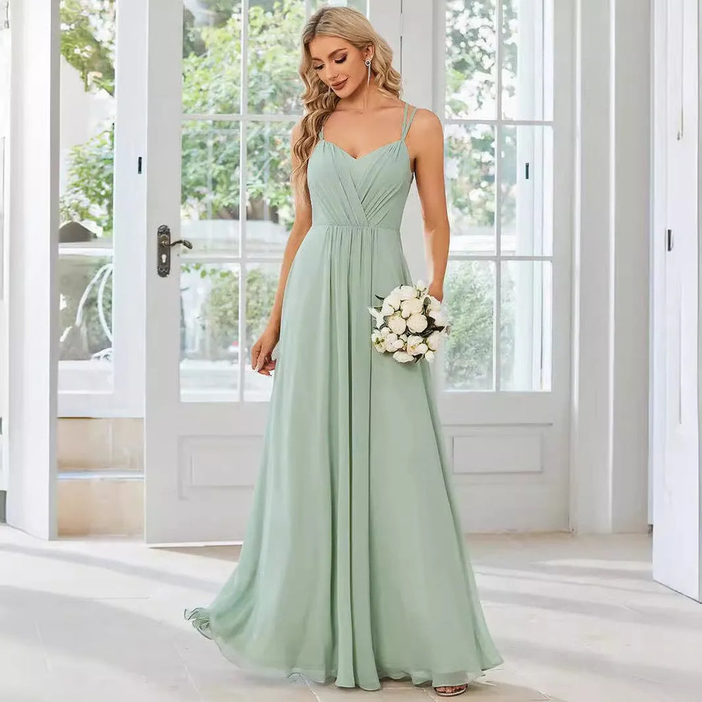 Women's sleeveless pleated A-line long dress in light green, shown in a solid colour with a long skirt.