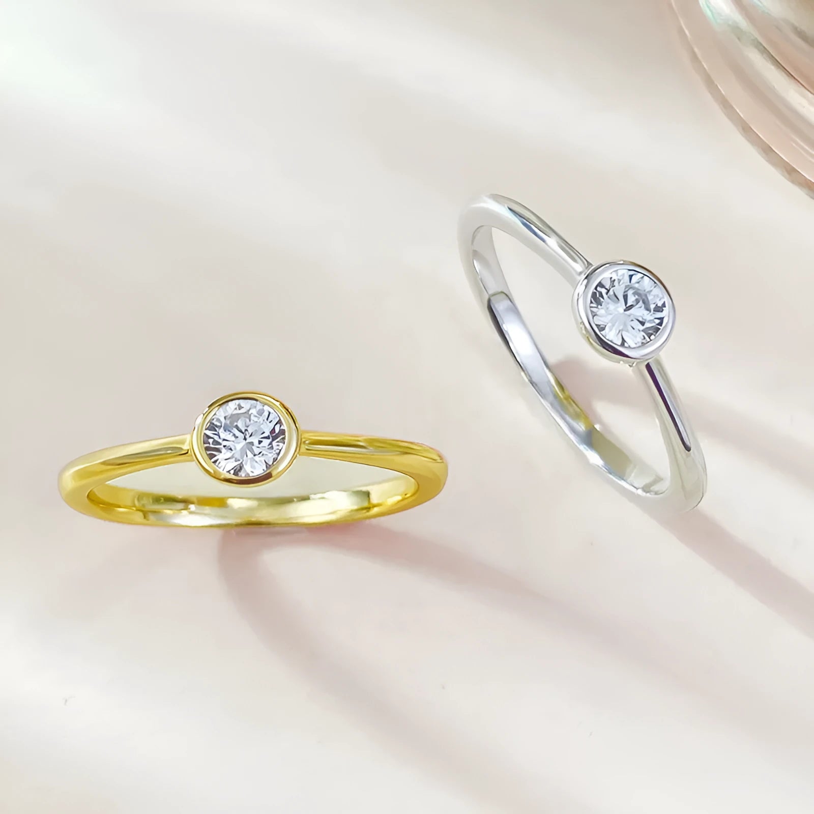 Minimalist crown-shaped silver ring with line detailing, shown in electroplated gold and platinum finishes