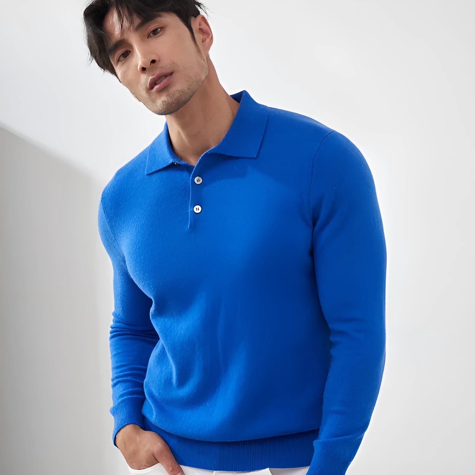 Man wearing a sapphire blue cashmere pullover sweater with a polo collar