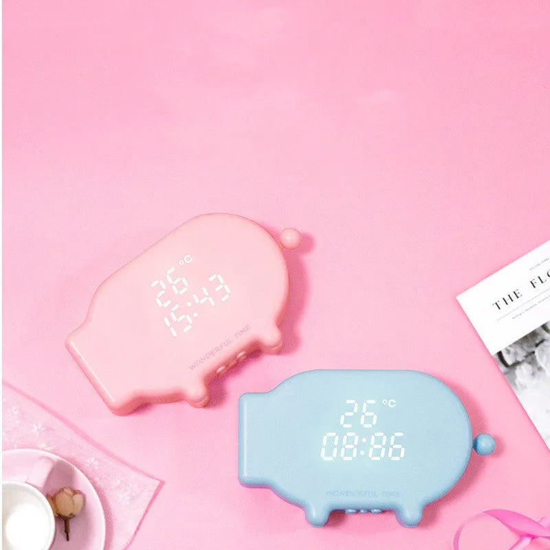 Multifunctional LED alarm clock with temperature display available in blue or pink with USB cable