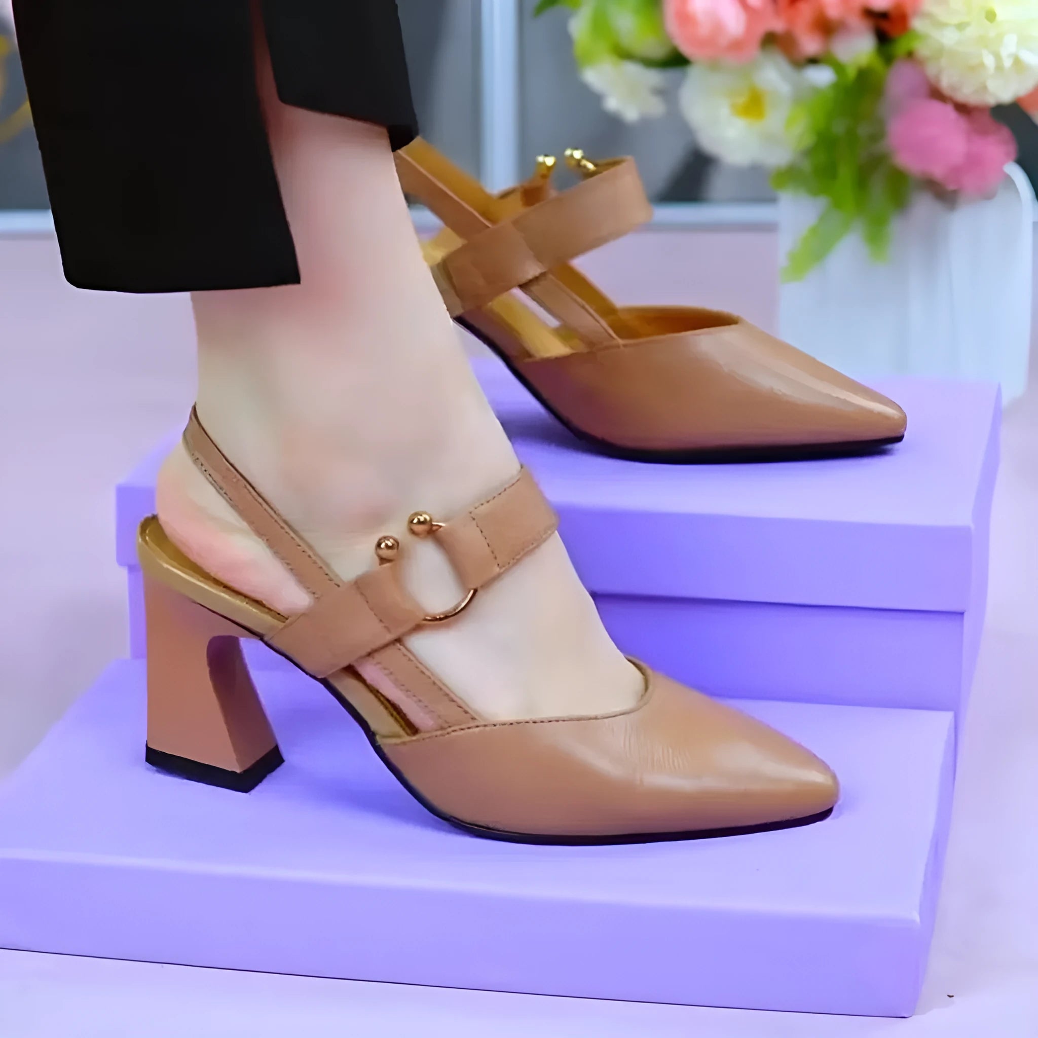 Women's black closed toe leather sandals with a chunky block heel and strapless slip-on design.