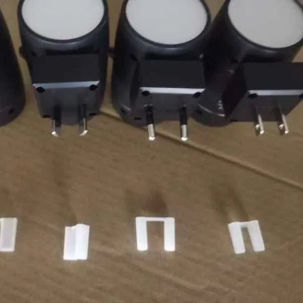 White plug-in rotatable night lamp with induction sensor and adjustable brightness control dial.