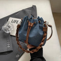 Blue one-shoulder cross body bucket bag with synthetic leather lining and sandwich pocket design