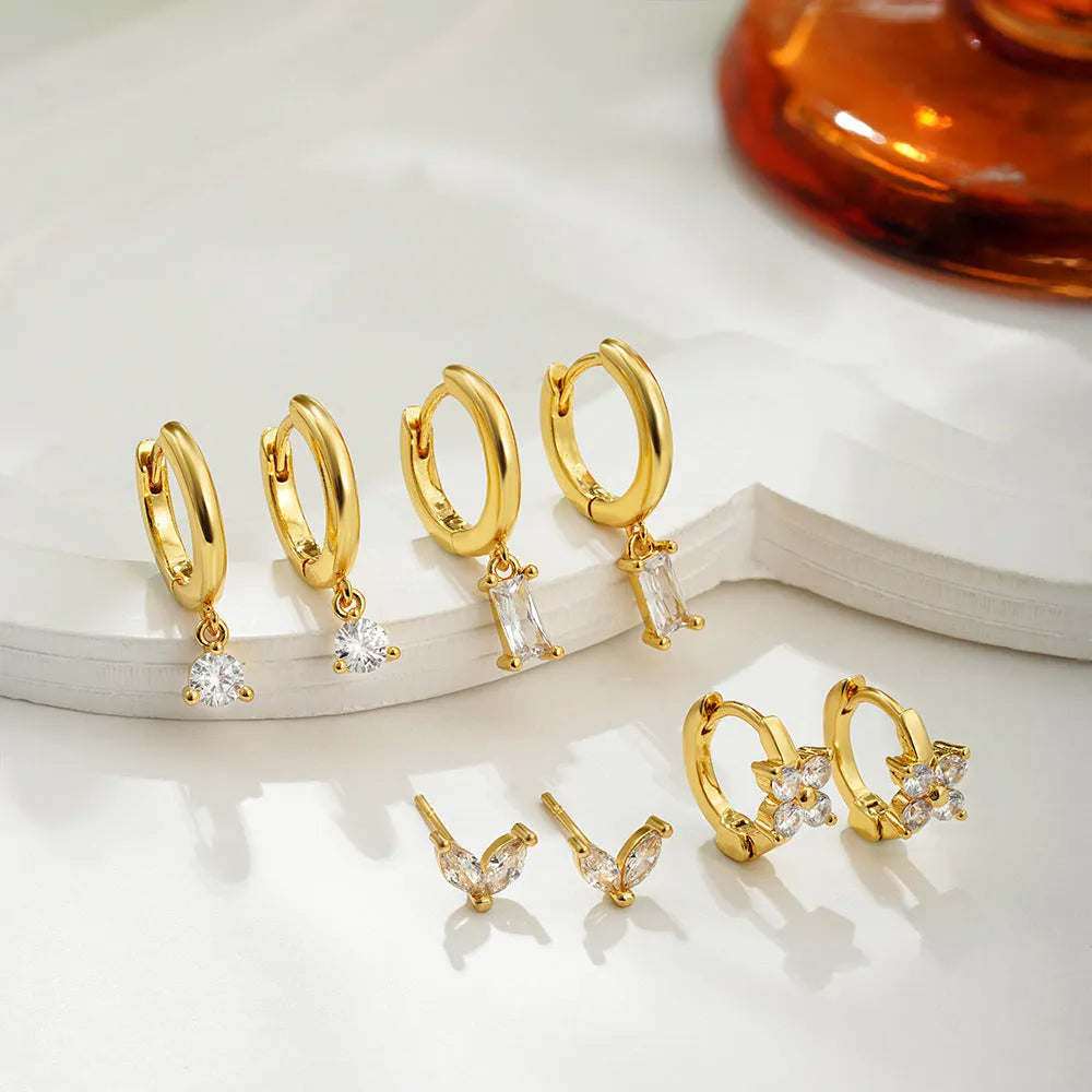 Copper electroplated geometric earring set with star designs in gold or silver tone options