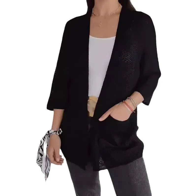 Women's thin waffle weave cardigan coat in army green with pockets, shown on a hanger.