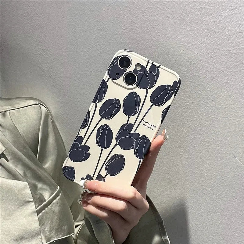Black silicone phone case with a tulip floral pattern for iPhone.