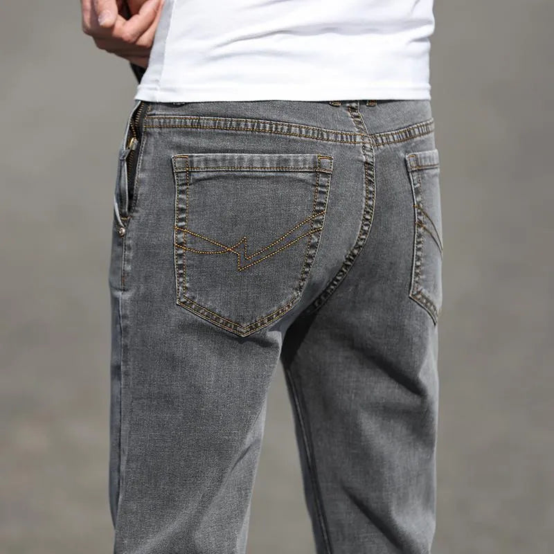 Men's smoky gray jeans with straight leg cut and rabbit fur fabric showing zip fly closure