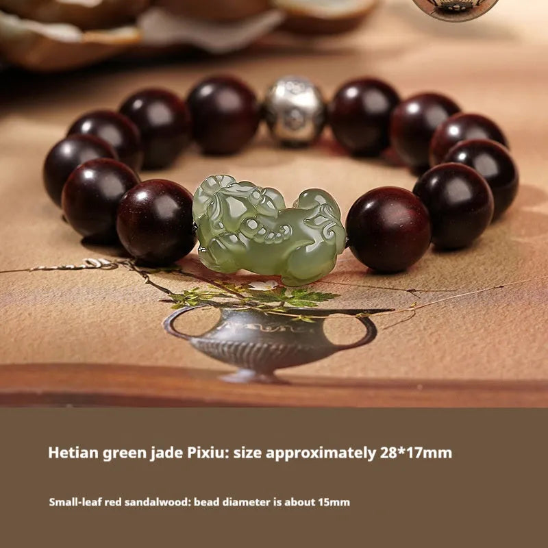 A Hetian jade bracelet with braided black and red rope in a Chinese style design.