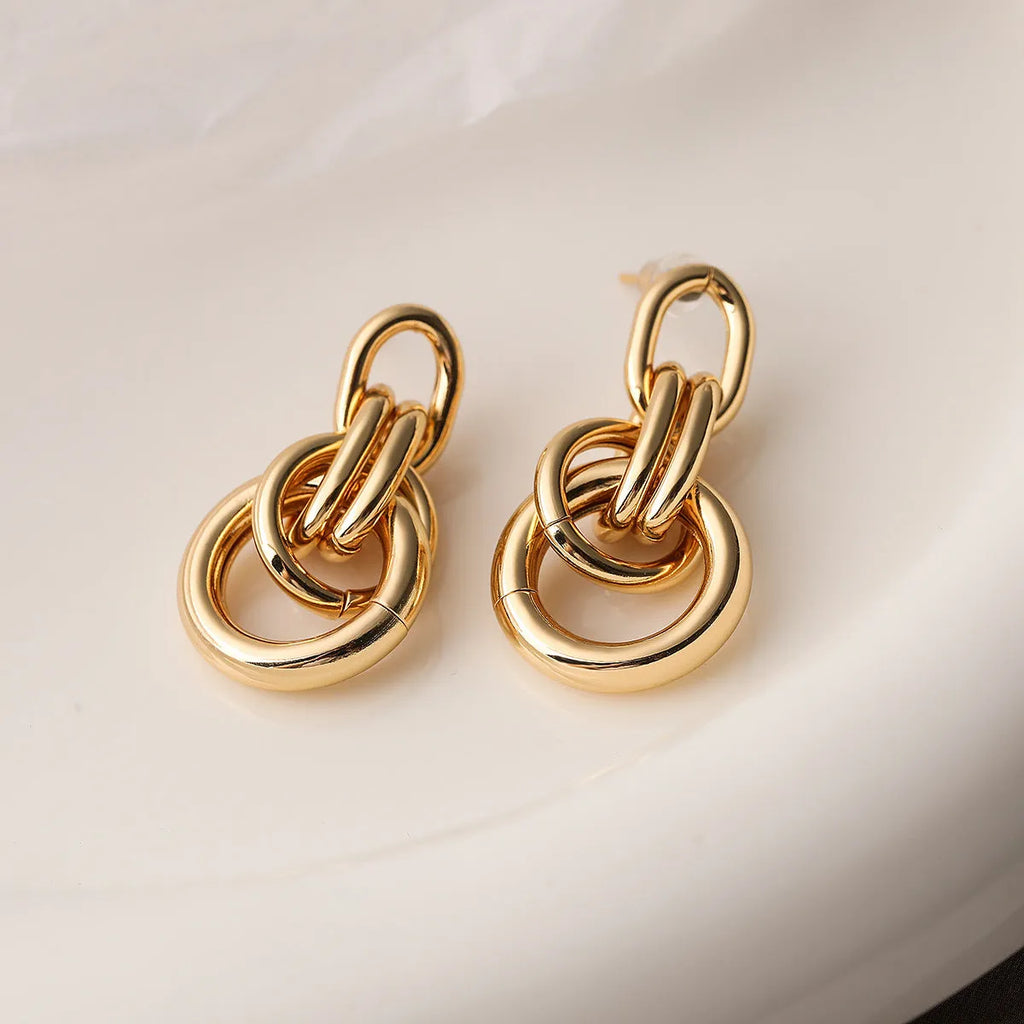 Geometric copper earrings with 18K gold plating in irregular shapes approximately 20-24cm long