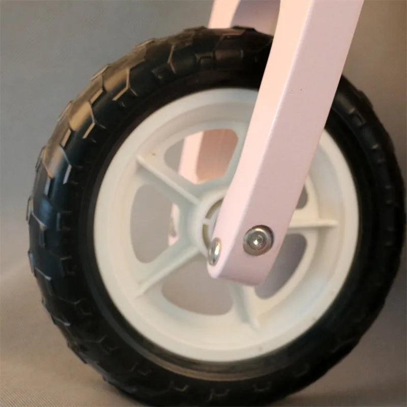Pink wooden toddler balance scooter with a 10-inch wheel for children aged 1 to 6 years.
