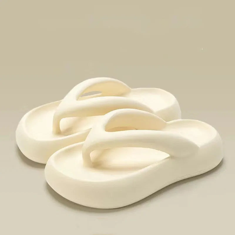 Solid colour women's flip-flops with a thick sole, decorative bow, and thong strap.