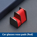 Green zinc alloy and leather glasses clip holder mounted on a car dashboard.