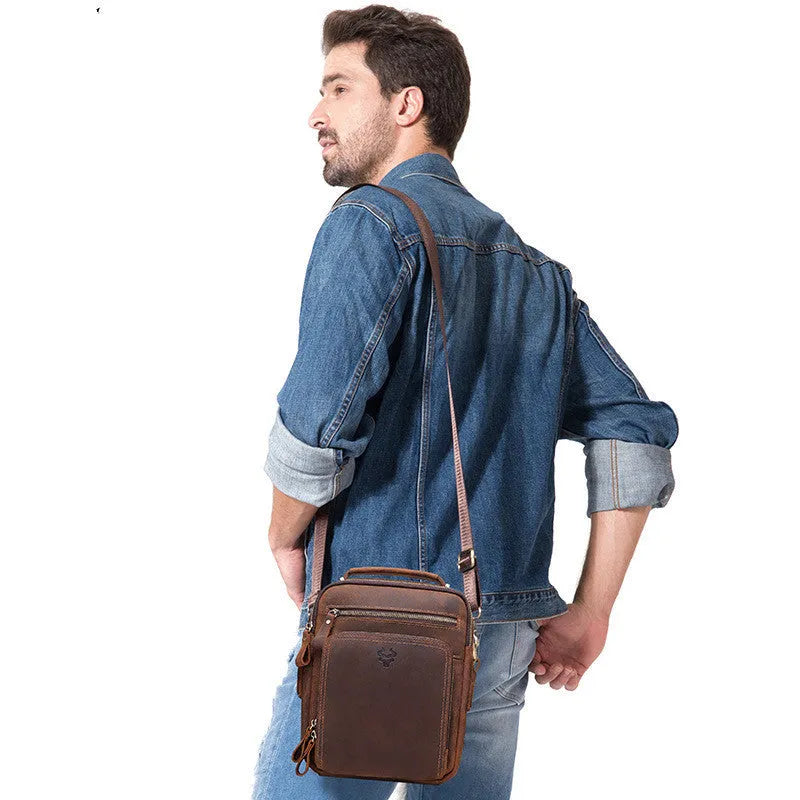 Men's brown Crazy Horse leather crossbody bag with sewing line details and crossbody strap