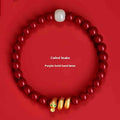 Handmade red cinnabar bracelet with snake Zodiac bead on a wrist, showing 8mm bead size.