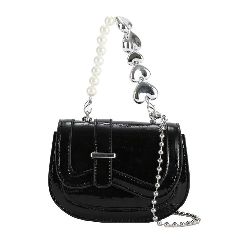 Laser pearl effect mini saddle tote handbag in horizontal square shape with crossbody strap