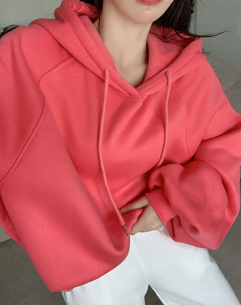 Watermelon red women's sleeveless Mulberry Silk hoodie on a hanger.