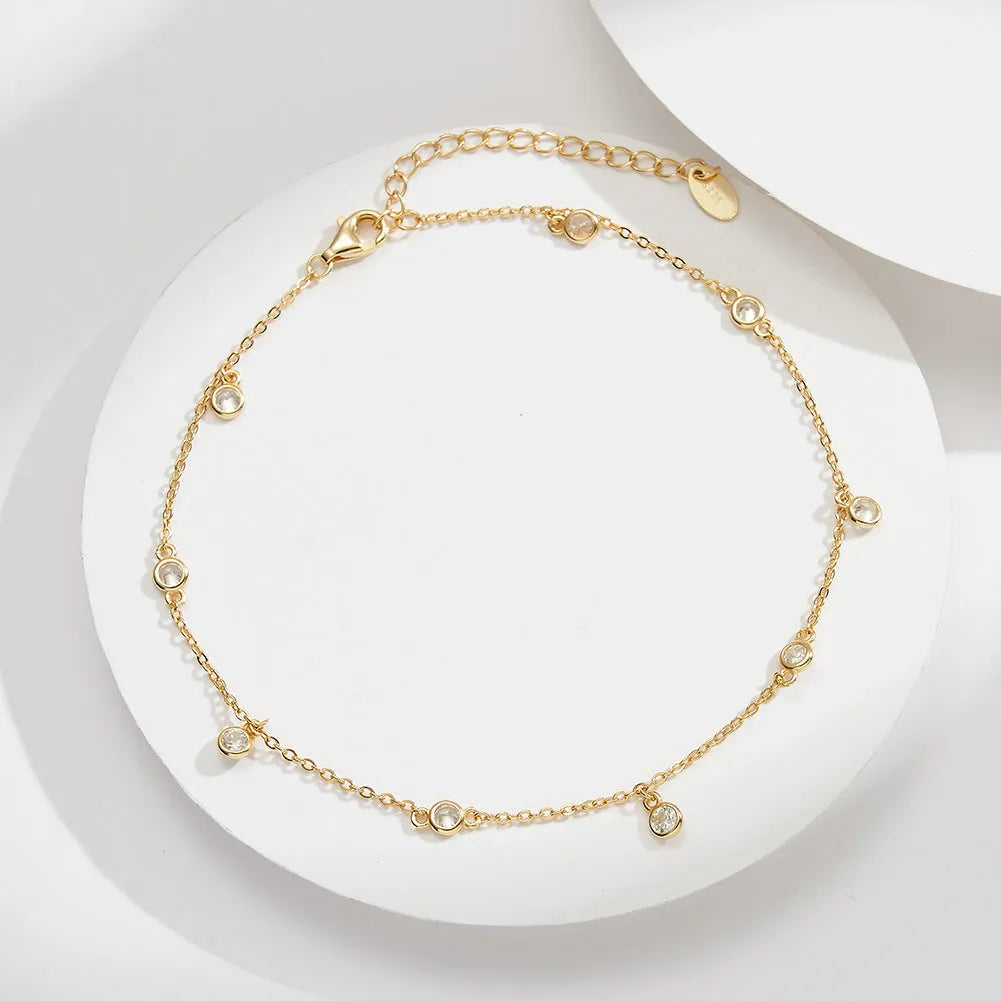 Women's sterling silver anklet with geometric zirconium pendant in gold finish