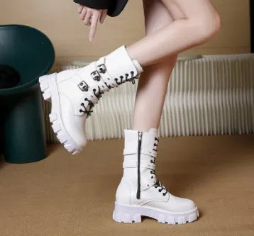 Women's black mid-calf knight boots with side zipper and metal belt buckle on artificial PU upper.