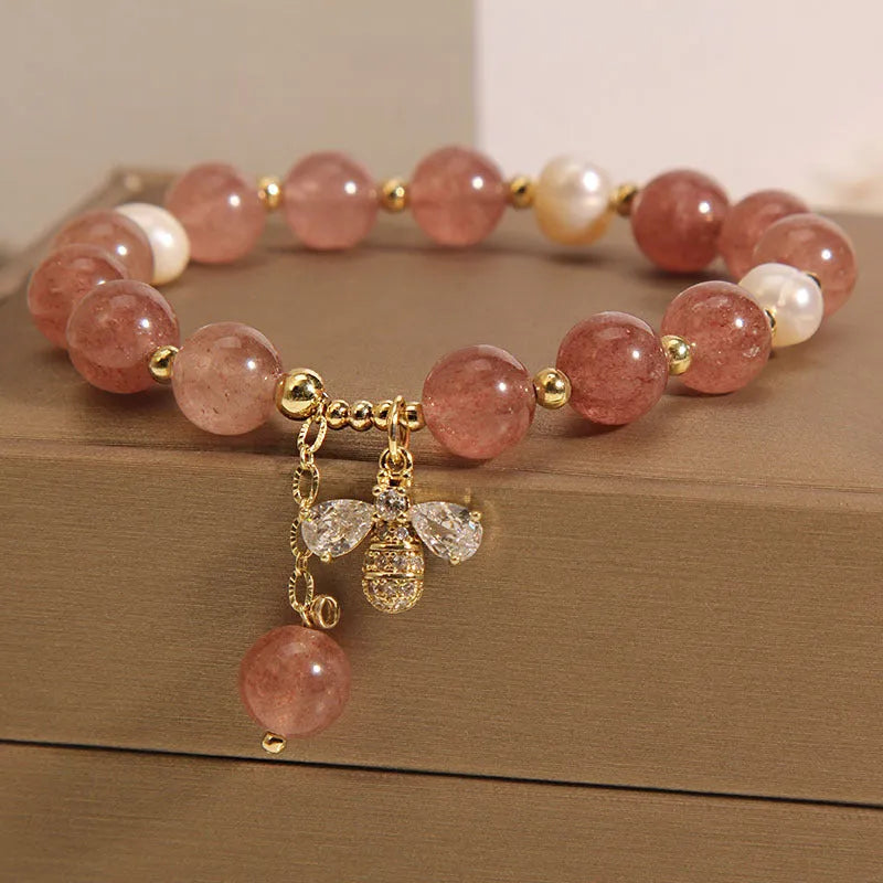 Women's freshwater pearl and strawberry quartz bracelet with zircon details on alloy chain