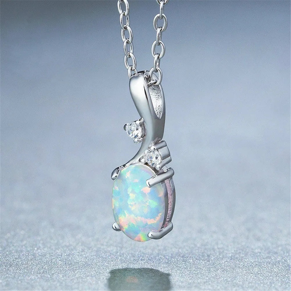 Water drop shaped opal pendant on adjustable chain necklace in rose gold or white finish