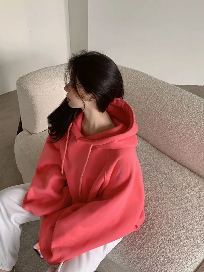 Watermelon red women's sleeveless Mulberry Silk hoodie on a hanger.