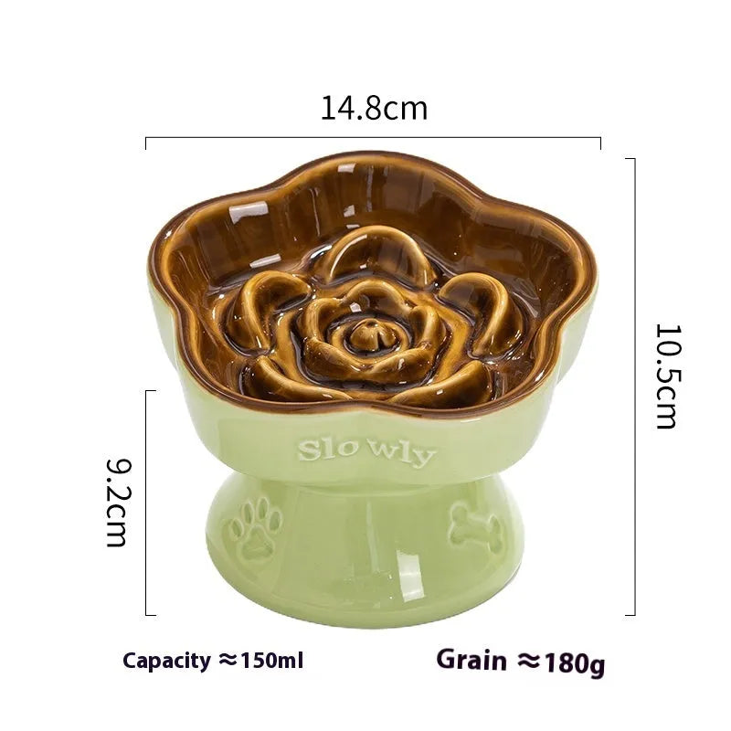Black ceramic pet bowl with a raised foot and high neck guard for dogs and cats.