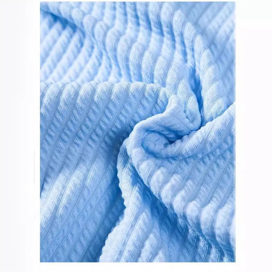 Men's loose fit short sleeve polyester summer shirt on a hanger, shown in a light blue colour.