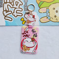 Lucky Cat blessing certificate set showing plastic card sleeve and ferrule pendant in cartoon style.