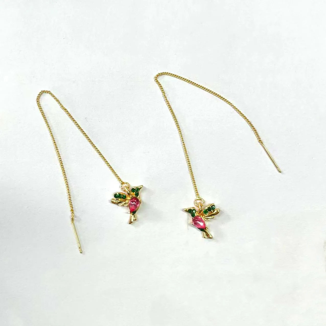 Long drop bird shaped alloy earrings for women with zirconium wings, shown in blue, red, and red lvzuan colour variations.
