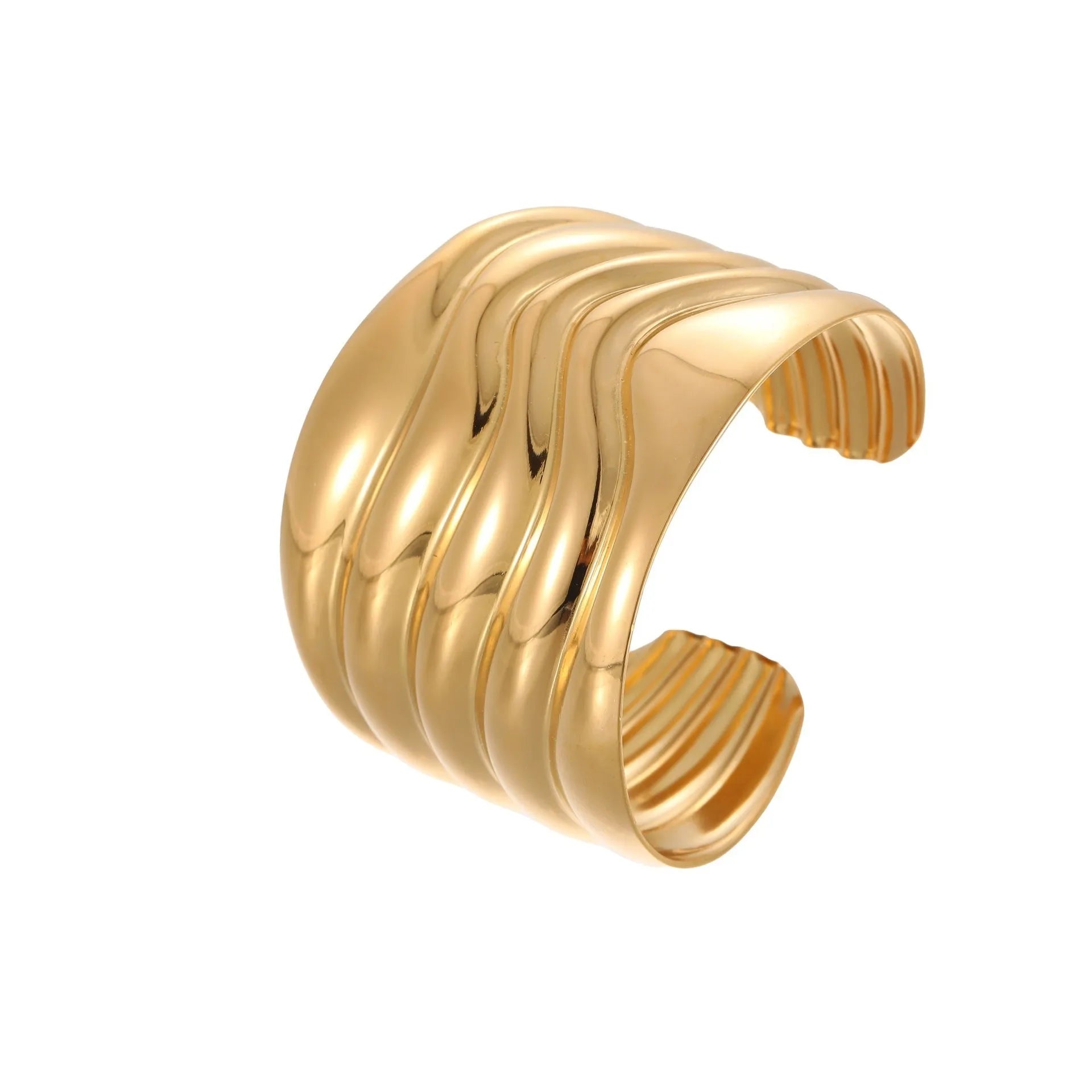 Women's wide stainless steel bracelet with 18K gold plating showing geometric wave patterns
