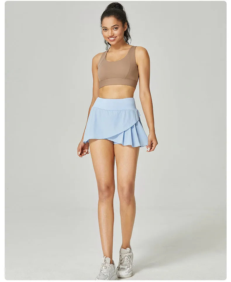 Women's solid colour quick-drying nylon sports shorts on a hanger, shown in light blue.