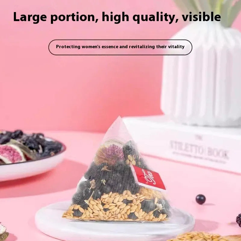 Pack of mulberry flaxseed fig tea bags for women's health with a free cup.