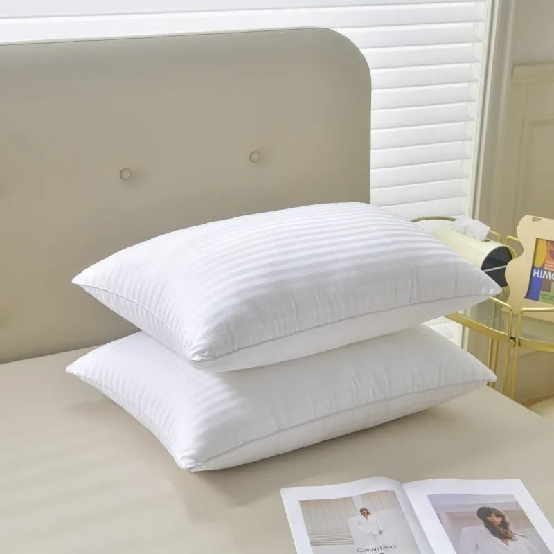 White hotel cotton satin stripe feather and cotton blend pillow showing satin stripe detail.